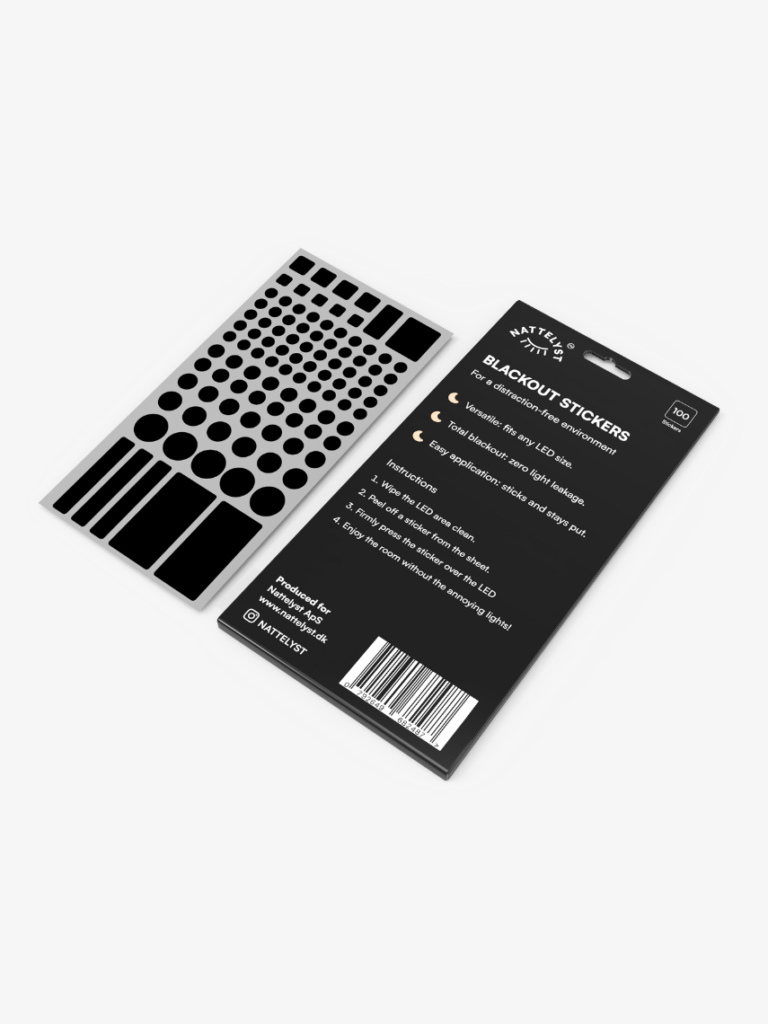 Schwarze Blackout-Sticker in verschiedenen Formen neben schwarzer Verpackungsrückseite mit Anwendungshinweisen und Barcode